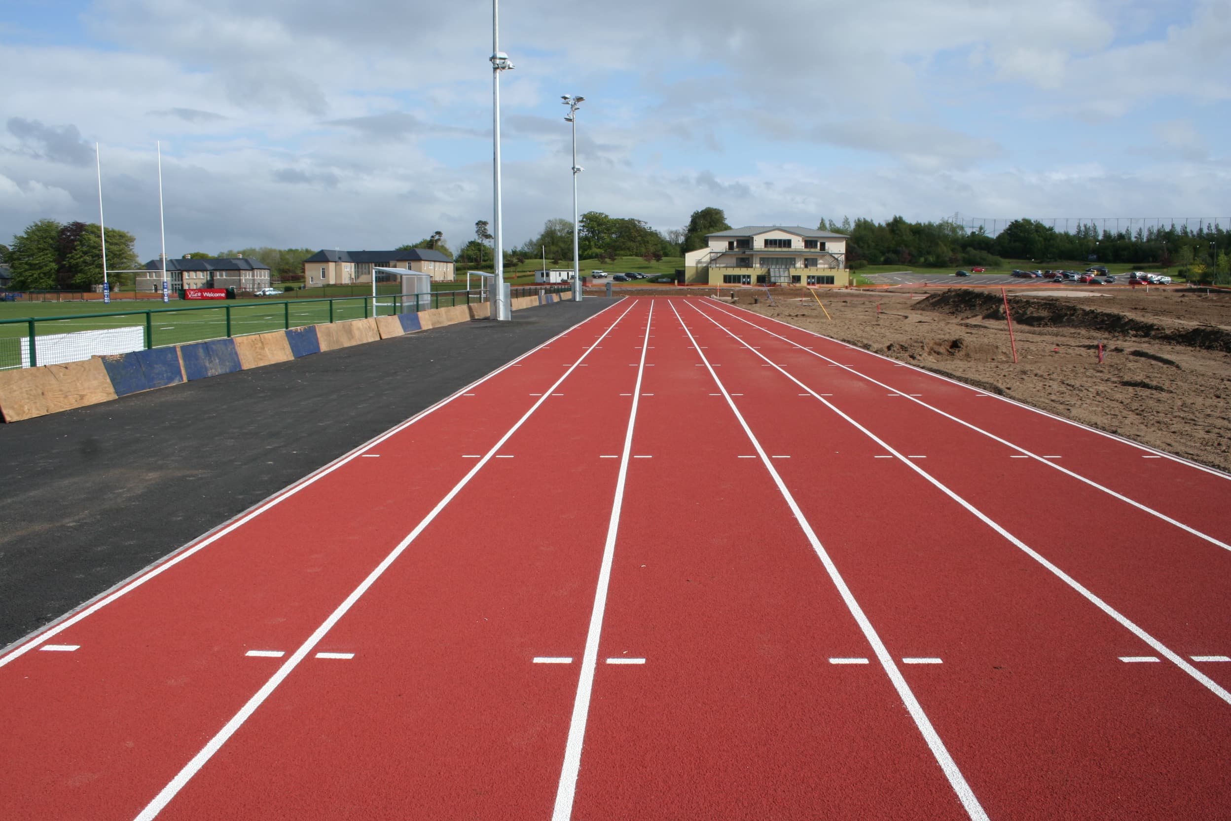 Marked synthetic sprint track beside training pitches